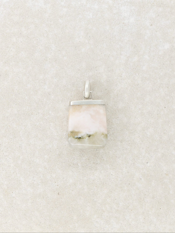 Square pendant with a natural pattern on a textured beige background